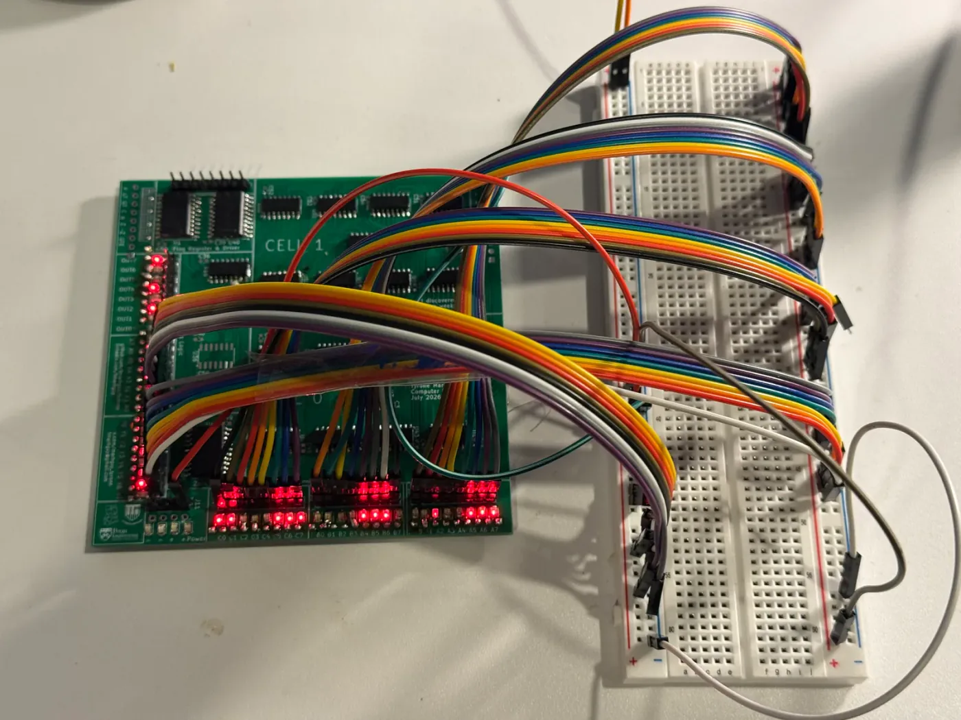 Half-assembled 07_alu board under test — LEDs and logic lit on the bench.